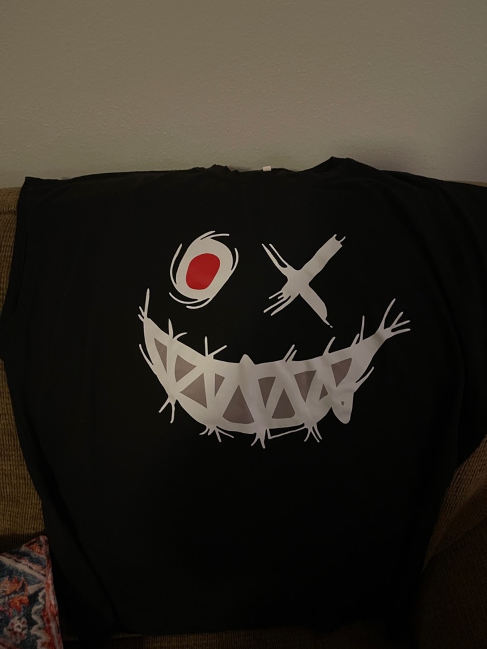 Black Graphic Tee with White Smiley and Red Accent
